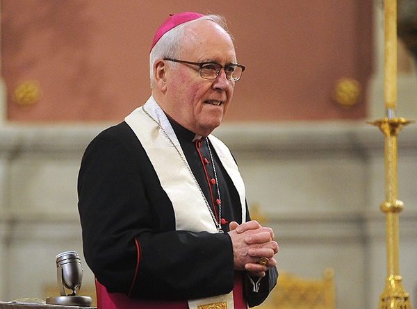 Bishop Richard J. Malone speaks to the congregation before blessing Easter Baskets in front of the altar at Corpus Christi Church. (Dan Cappellazzo/Staff Photographer)